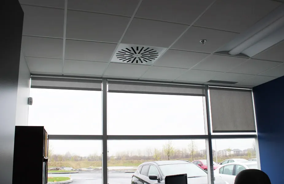 AXO-S installed in an office ceiling with a large window - New QAT Offices