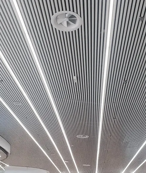 AX6 Adjustable Round Swirl Diffuser Installed in High Architectural Ceiling