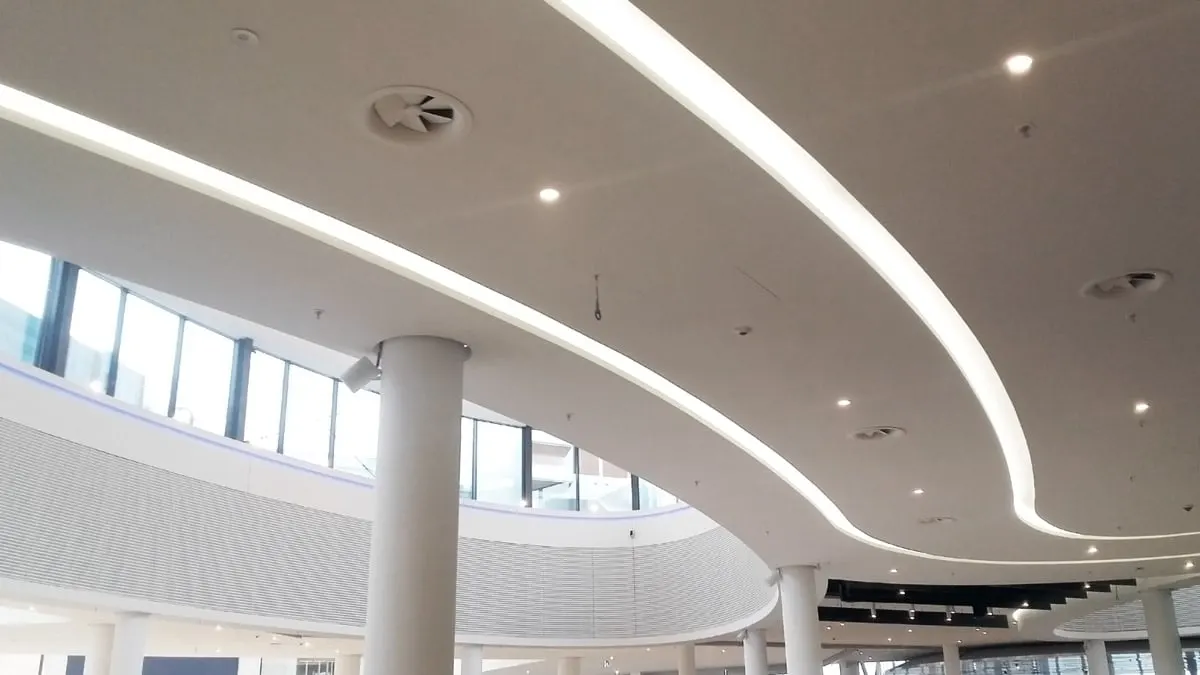 AX6 Adjustable Round Swirl Diffuser Installed in Gallery With High Ceilings