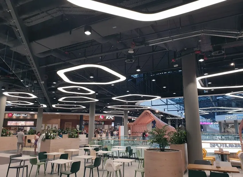 AX6 Adjustable Round Swirl Diffusers in a Shopping Center's Restaurant Area